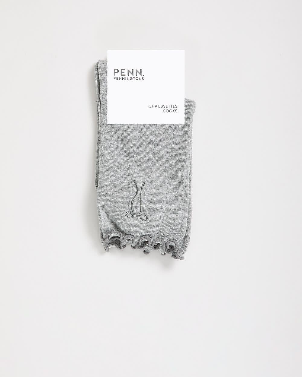 Chaussettes à rebord ondulé avec boucle brodée