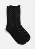 Chaussettes noires à petits pois avec bord roulé