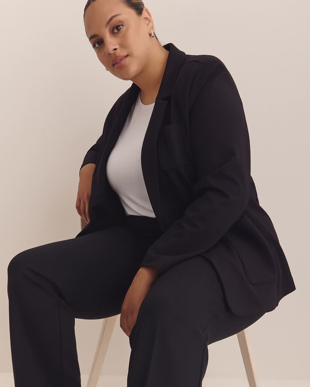 Pantalon amincissant noir à  jambe droite en pointe de Rome