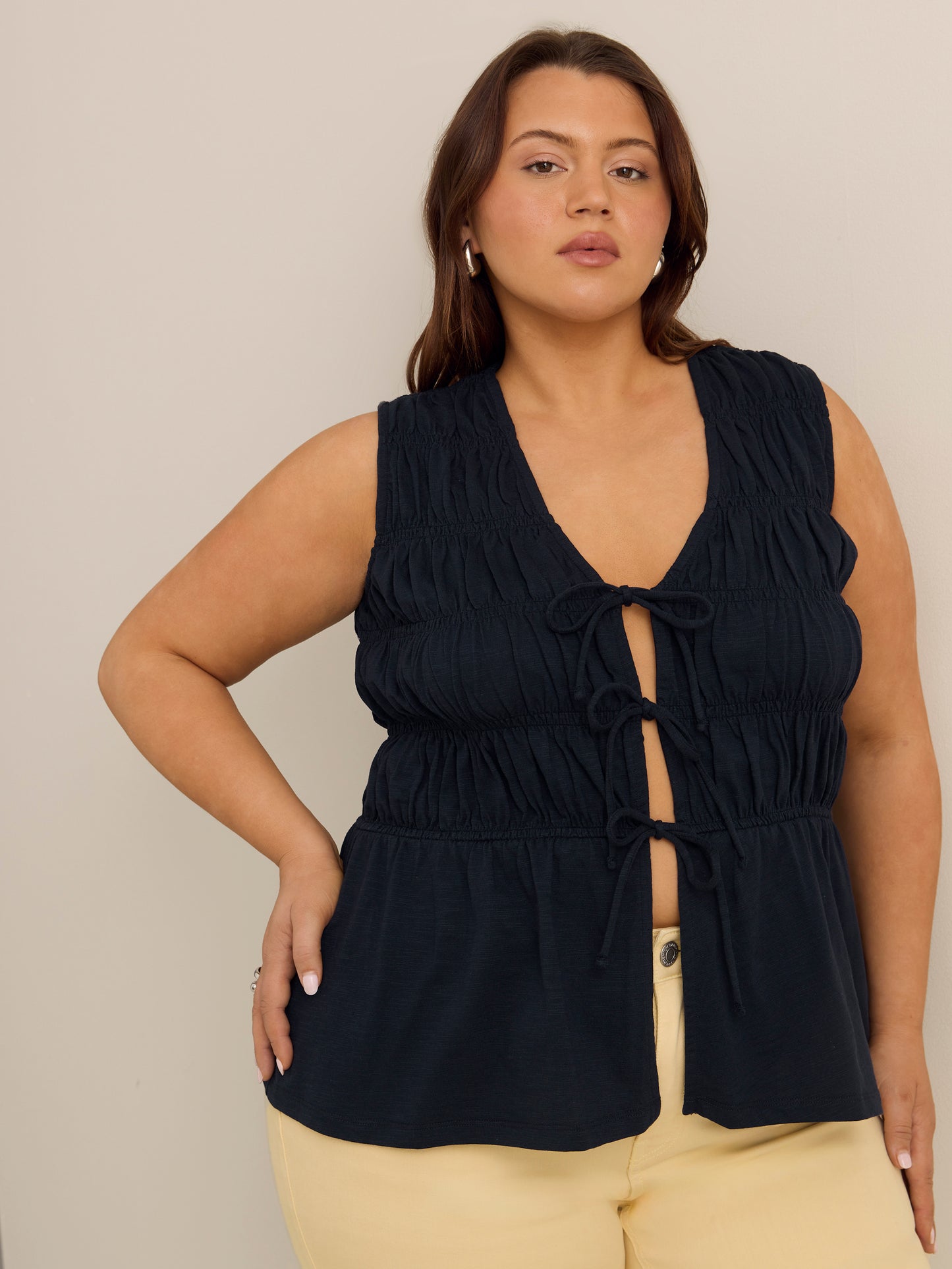 Flared Sleeveless V-Neck Tie-Front Smocked Blouse - Addition Elle