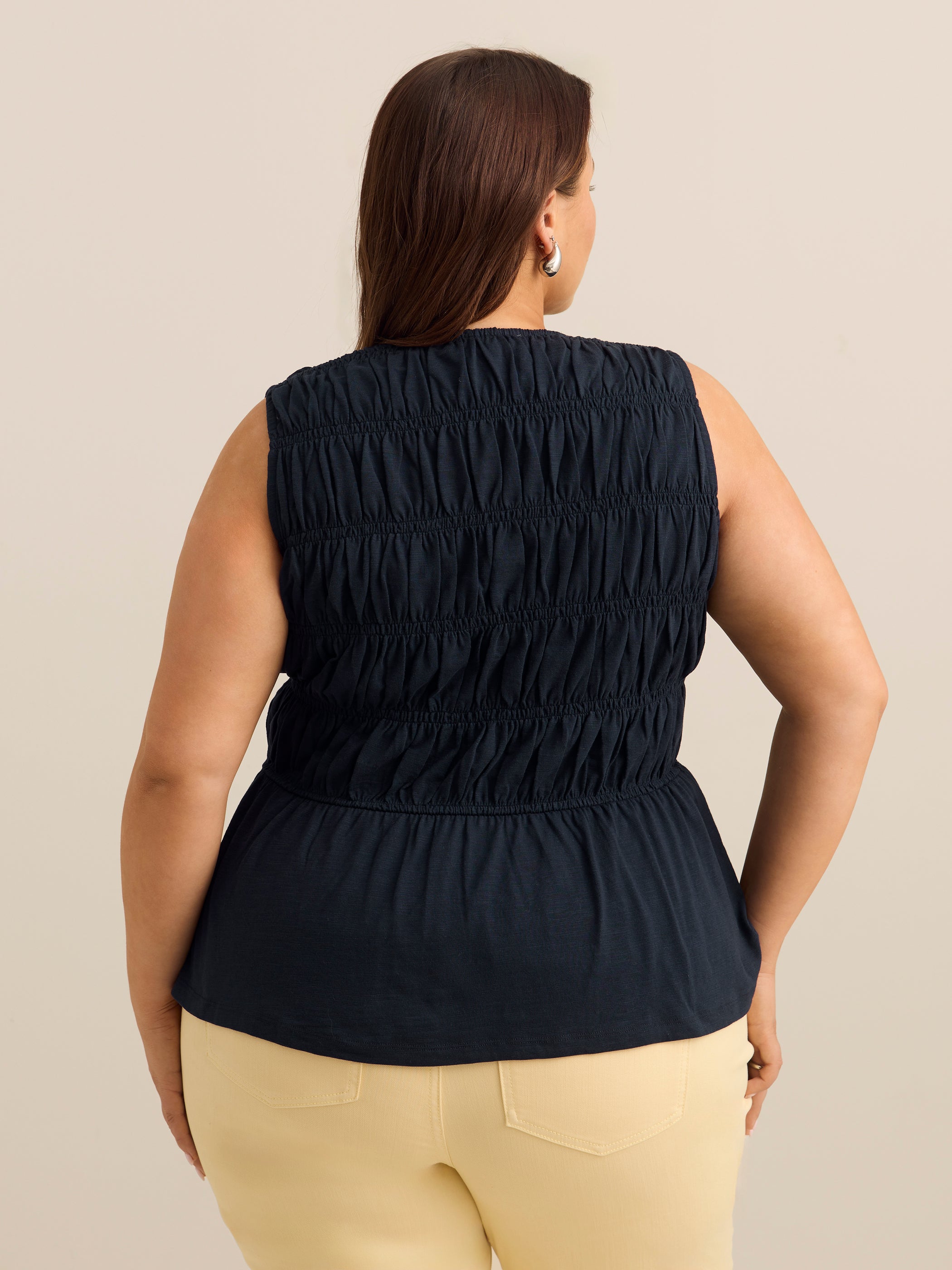 Flared Sleeveless V-Neck Tie-Front Smocked Blouse - Addition Elle