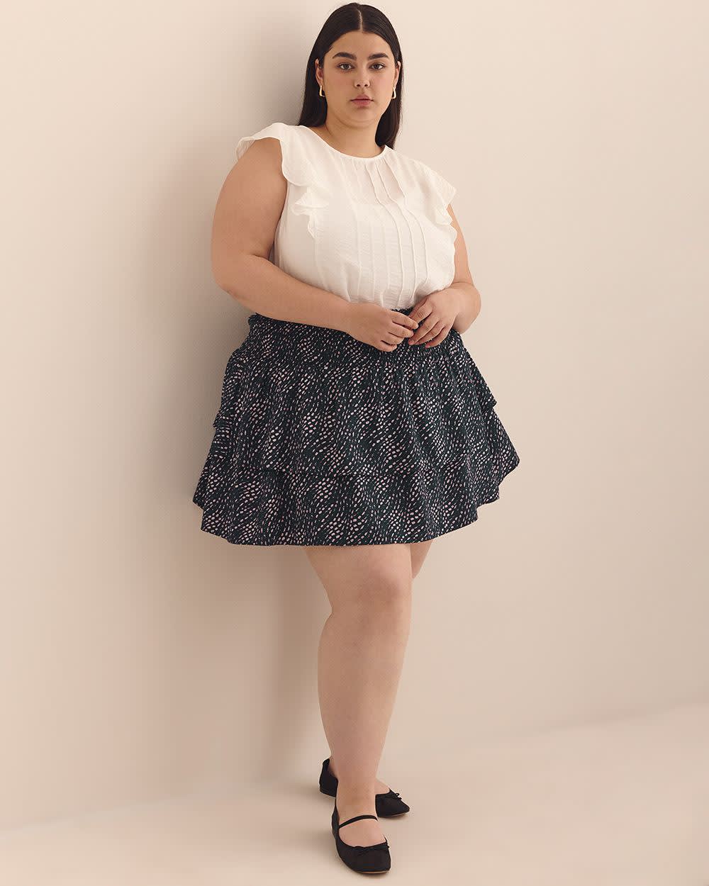 Mini-jupe étagée bleu marine à pois ondulés