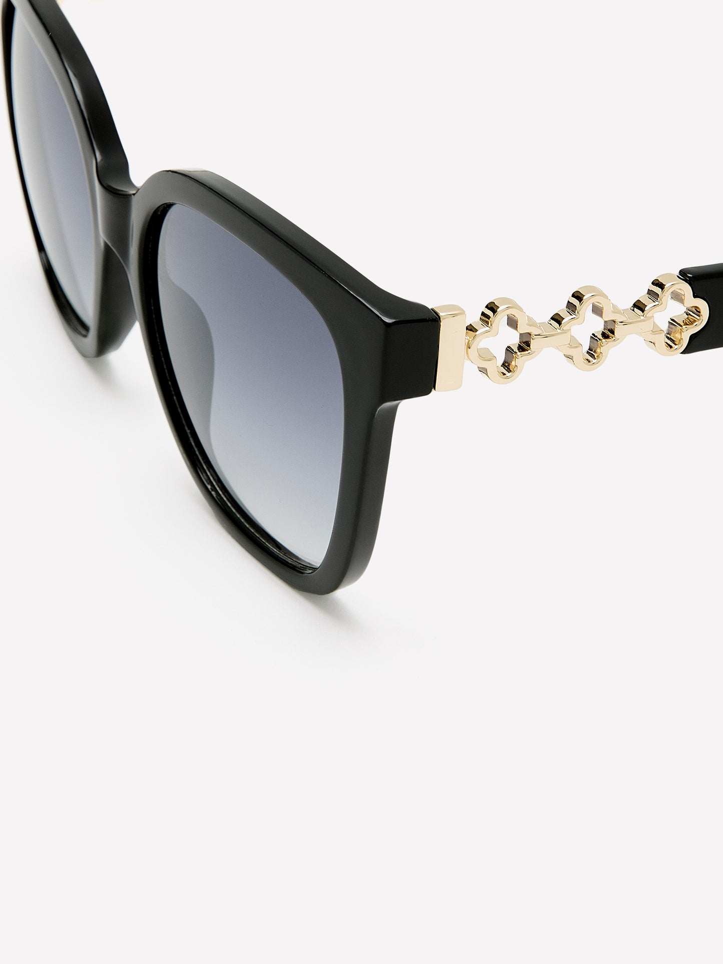 Lunettes de soleil oeil-de-chat noires avec branches en métal