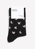 Chaussettes noires à motif de papillons avec rebord roulé