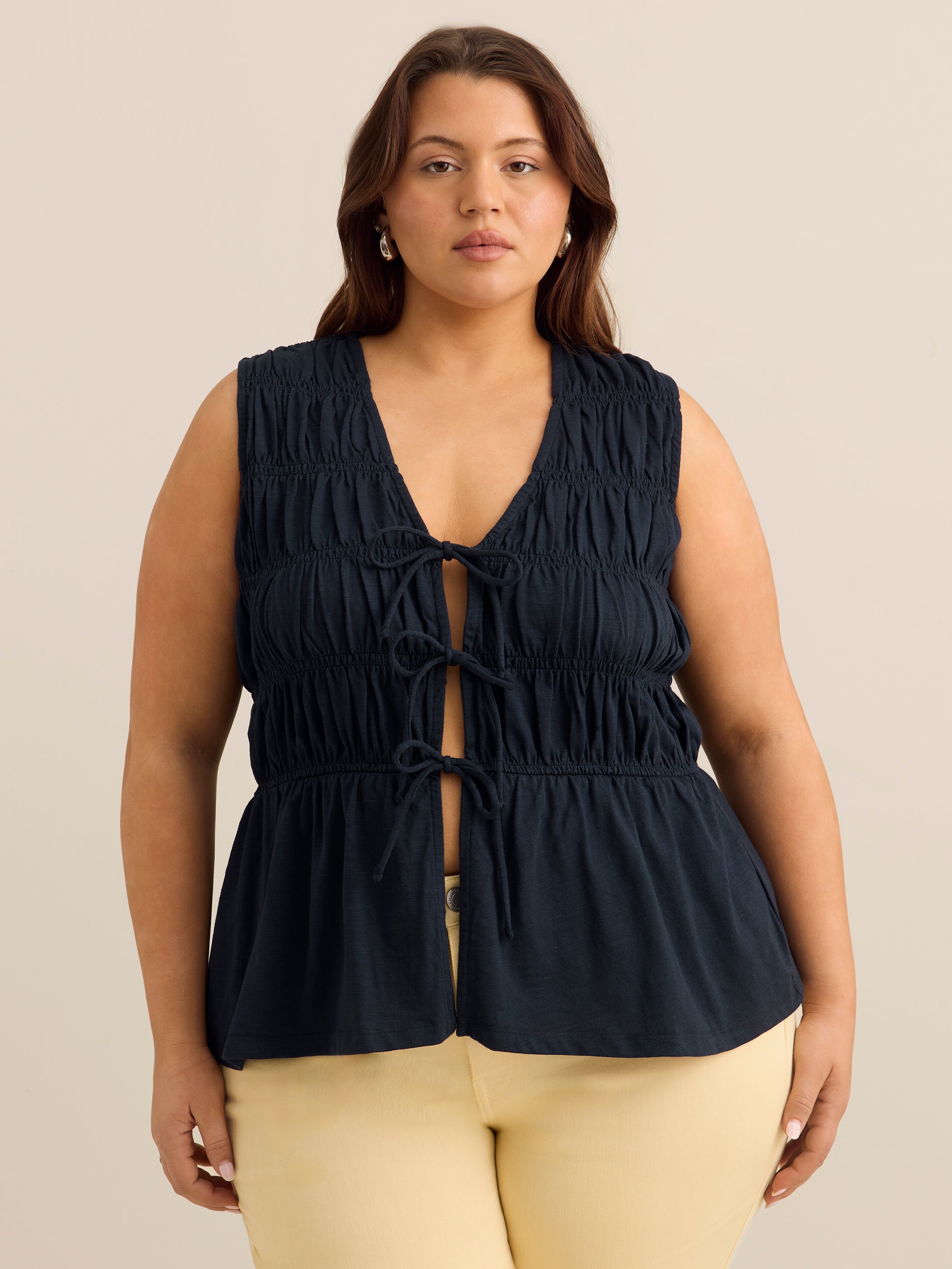 Flared Sleeveless V-Neck Tie-Front Smocked Blouse - Addition Elle