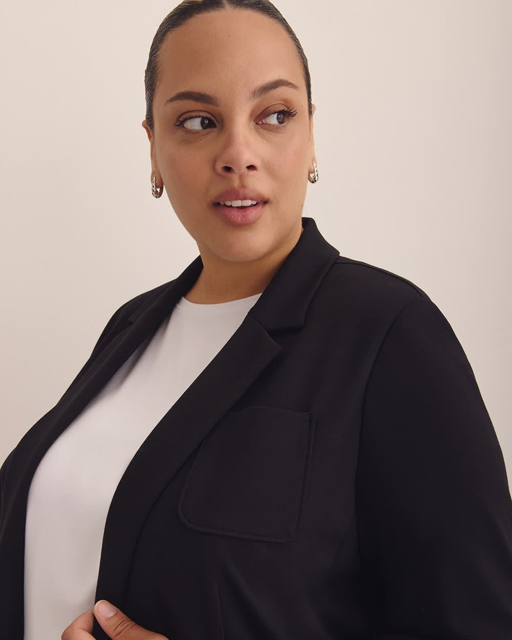 Veston noir en pointe de Rome avec col tailleur, tissu responsable