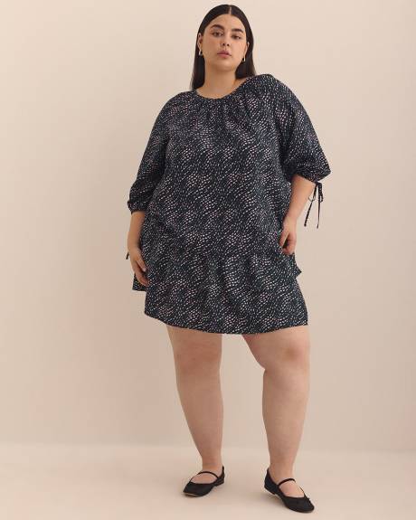 Blouse évasée à pois ondulés avec boutons
