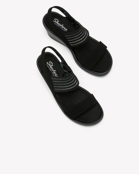 Sandale noire Rumblers à talon compensé avec sangle arrière, pied large - Skechers