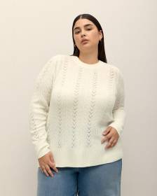 Pull à manches longues avec ouverture au dos et boucle en satin