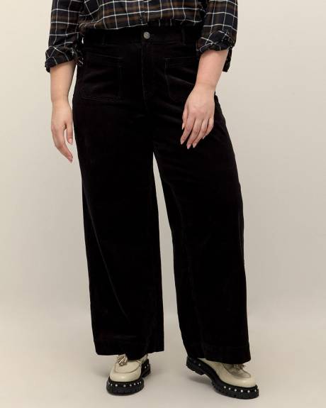 Pantalon en velours côtelé à jambe évasée, coupe galbée