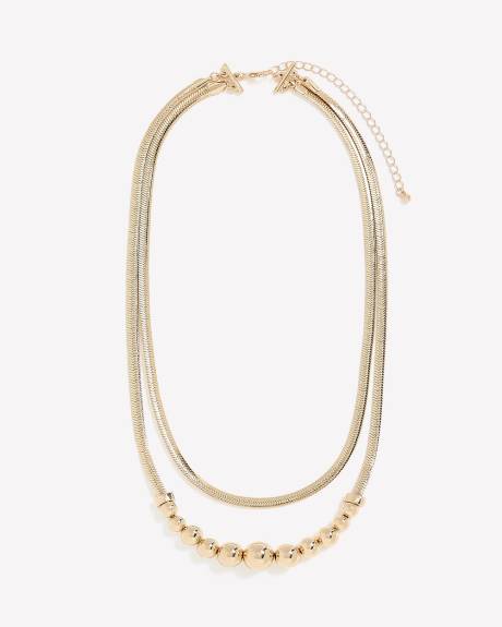 Collier doré court à deux chaînes avec billes