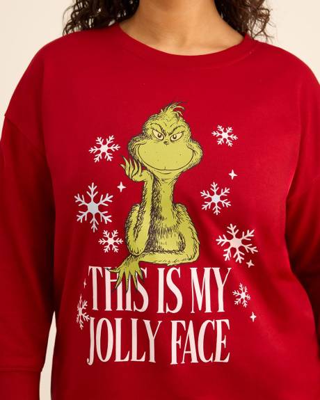 Pull rouge à col rond avec imprimé du Grinch