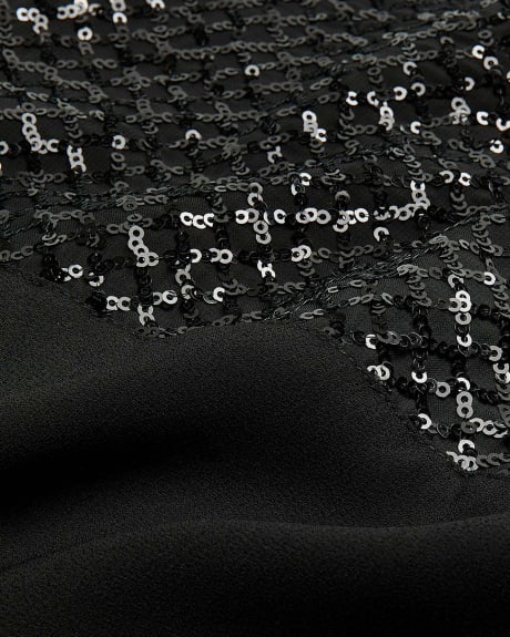 Robe noire avec manches en maille à paillettes - Addition Elle