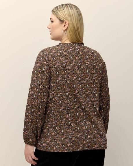 Haut fleuri en tricot texturé avec manches bouffantes