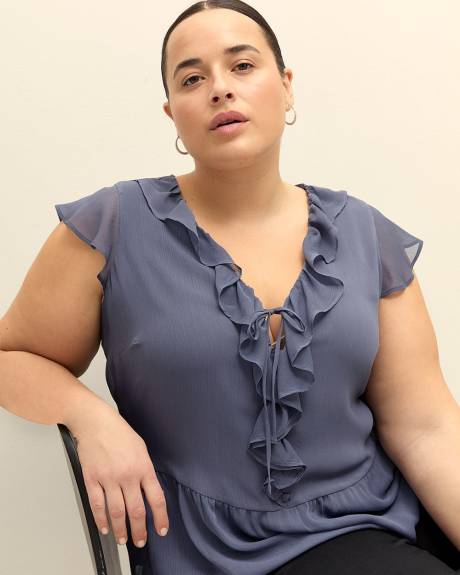 Blouse à manches courtes et col en V à volants