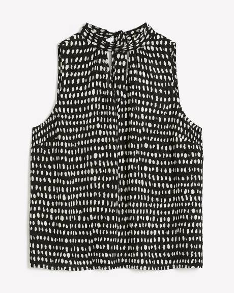 Blouse sans manches à col montant, motifs à pois allongés