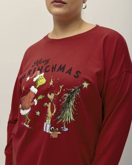Pull rouge à col rond avec imprimé du Grinch
