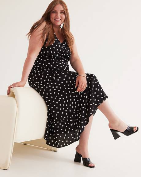 Robe longue sans manches à pois et ourlet asymétrique