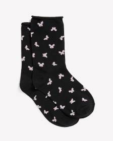 Chaussettes noires &agrave; motif de papillons avec rebord roul&eacute;