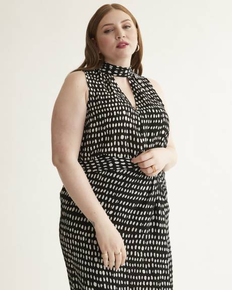 Blouse sans manches à col montant, motifs à pois allongés