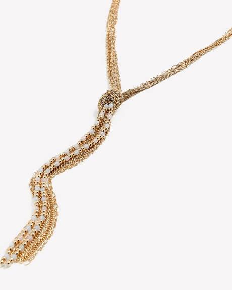 Collier doré noué avec pampilles