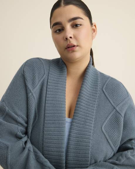 Veste cardigan tunique à mailles torsadées