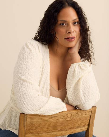 Haut textur&eacute; &agrave; manches longues et cordon &agrave; nouer