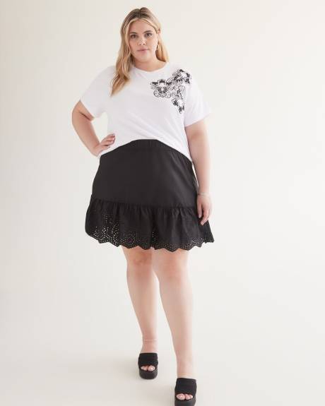 Mini-jupe noire en coton à enfiler avec volant brodé