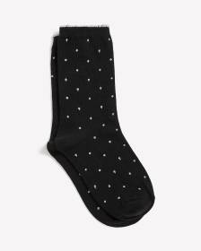 Chaussettes noires à pois métallisés et rebords festonnés Chaussettes noires à pois métallisés et rebords festonnés