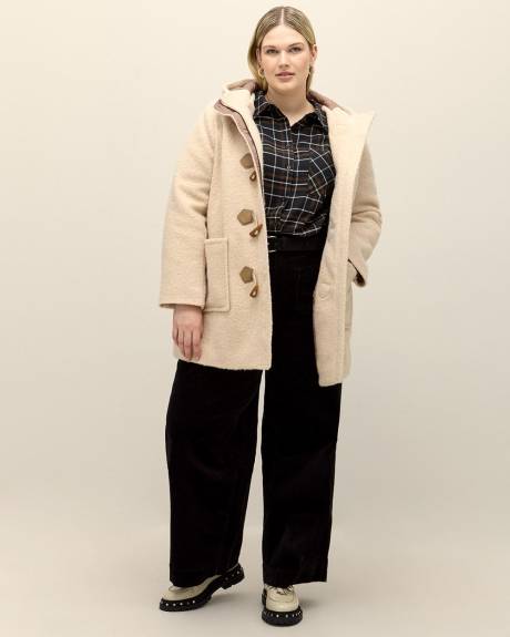 Pantalon en velours côtelé à jambe évasée, coupe galbée