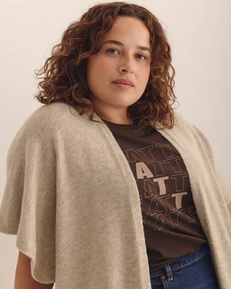 Cape en tricot avec poches