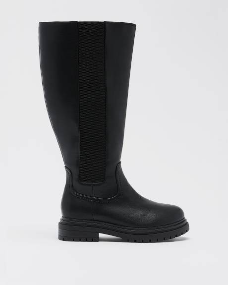 Bottes hautes noires à talon plat et bande élastique sur le côté, pied très large