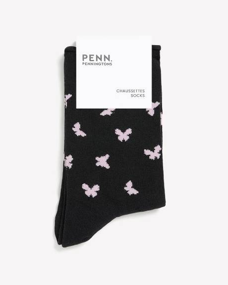 Chaussettes noires &agrave; motif de papillons avec rebord roul&eacute;