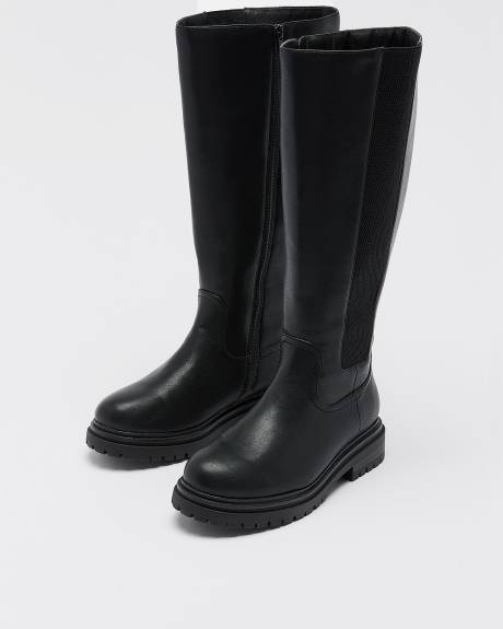 Bottes hautes noires à talon plat et bande élastique sur le côté, pied très large