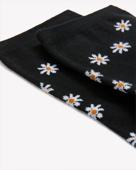 Chaussettes noires à imprimé de marguerites