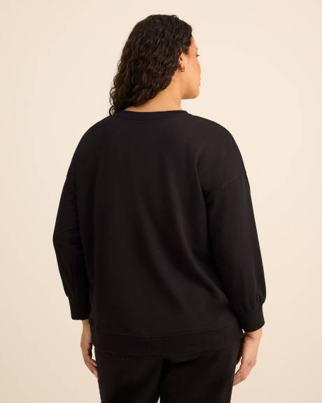 Pull noir à col rond avec imprimé du Grinch