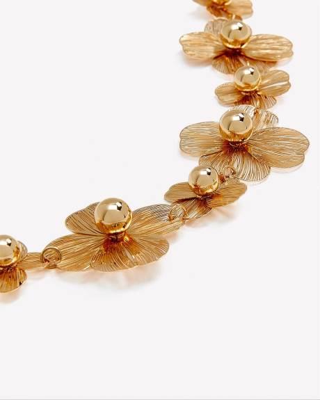 Bracelet orné de fleurs dorées en maille