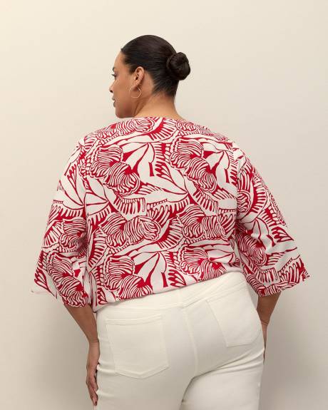 Blouse à encolure en V nouée à l'avant, tissu responsable
