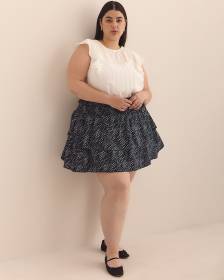 Mini-jupe étagée bleu marine à pois ondulés