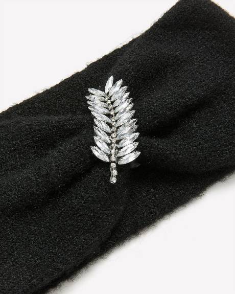 Bandeau noir avec bijou en forme de feuille