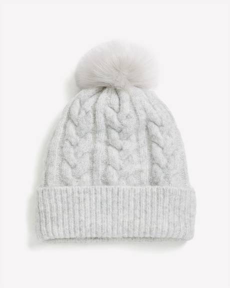 Bonnet à revers en laine à mailles torsadées avec pompon Bonnet à revers en laine à mailles torsadées avec pompon