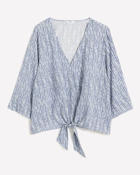 Blouse à encolure en V nouée à l'avant, tissu responsable