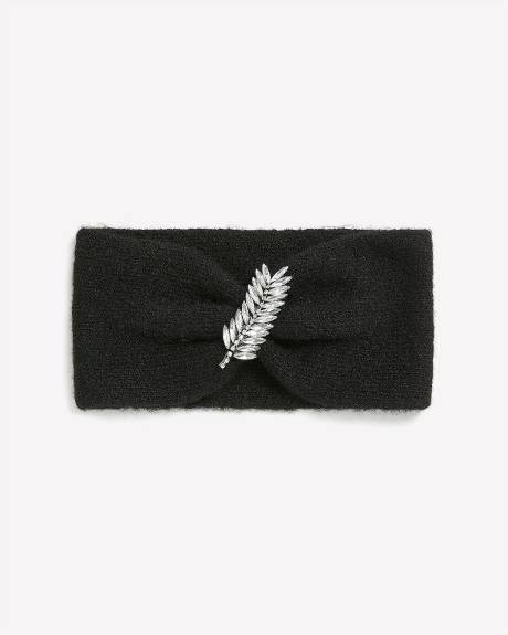 Bandeau noir avec bijou en forme de feuille