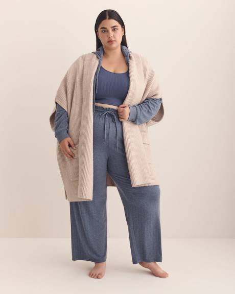 Cape en tricot côtelé épais avec poches