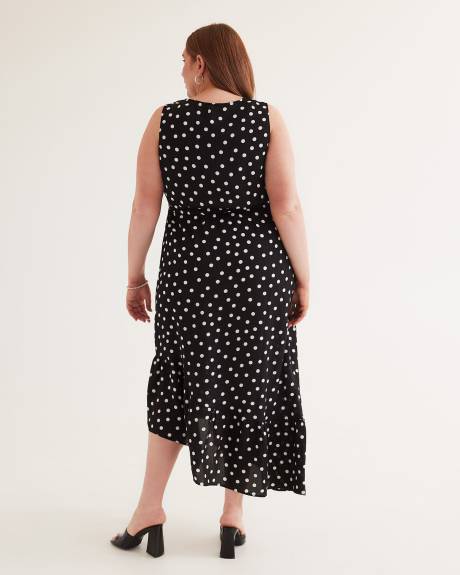 Robe longue sans manches à pois et ourlet asymétrique
