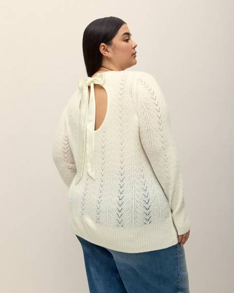 Pull à manches longues avec ouverture au dos et boucle en satin