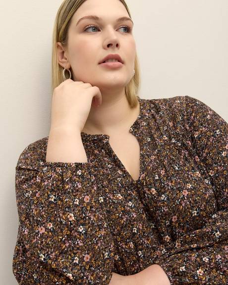 Haut fleuri en tricot texturé avec manches bouffantes