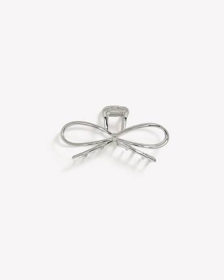 Pince à cheveux en métal en forme de boucle