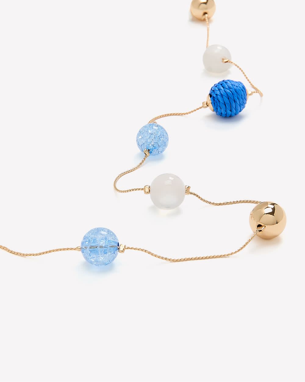 Collier long orné de billes assorties